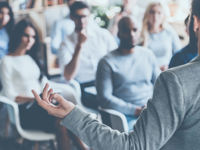 Man delivering training to an audience